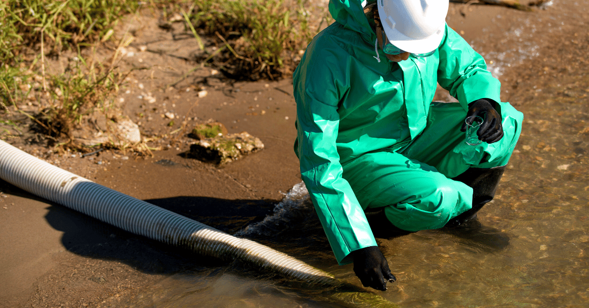 Environmentalist taking polluted water sample for examination